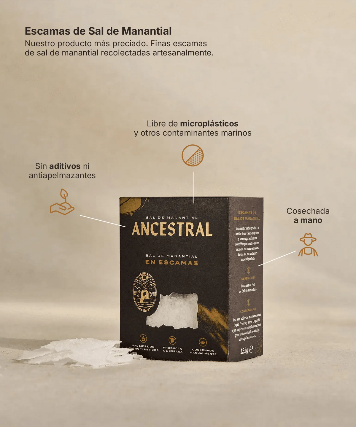 Black rectangular box of artisanal spring salt flakes with a clear window revealing white salt crystals.