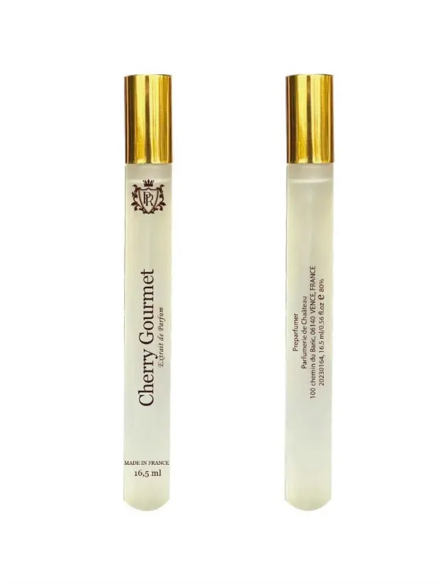 Two slim glass perfume vials with gold caps, labeled "Cherry Gourmet" with French origin text.