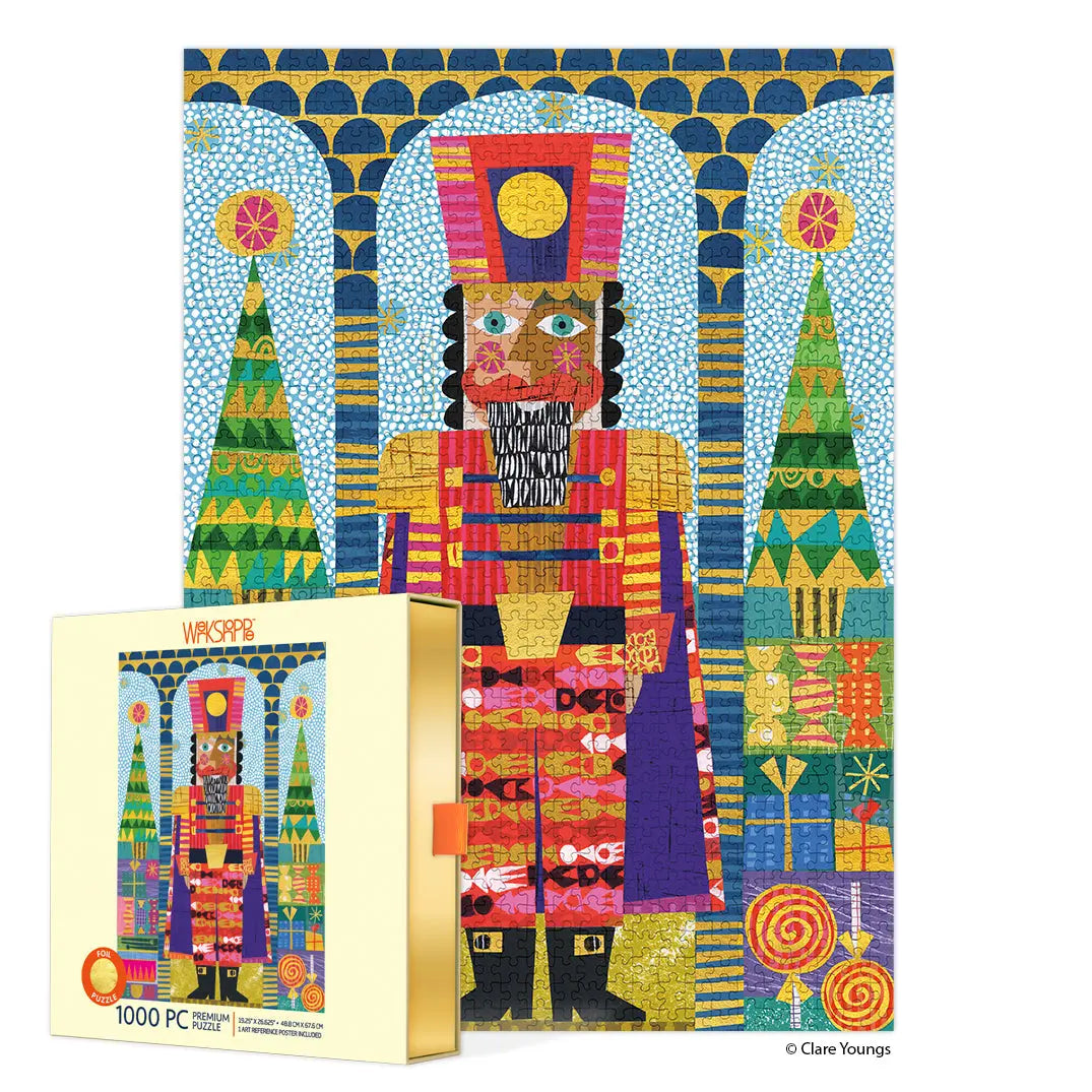 Colorful 1000-piece jigsaw puzzle featuring a folk-art nutcracker with gold foil accents and festive Christmas motifs.