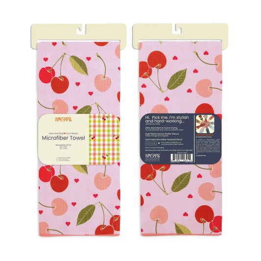 Pink microfiber kitchen towel with red cherry and heart pattern, featuring descriptive product packaging labels.