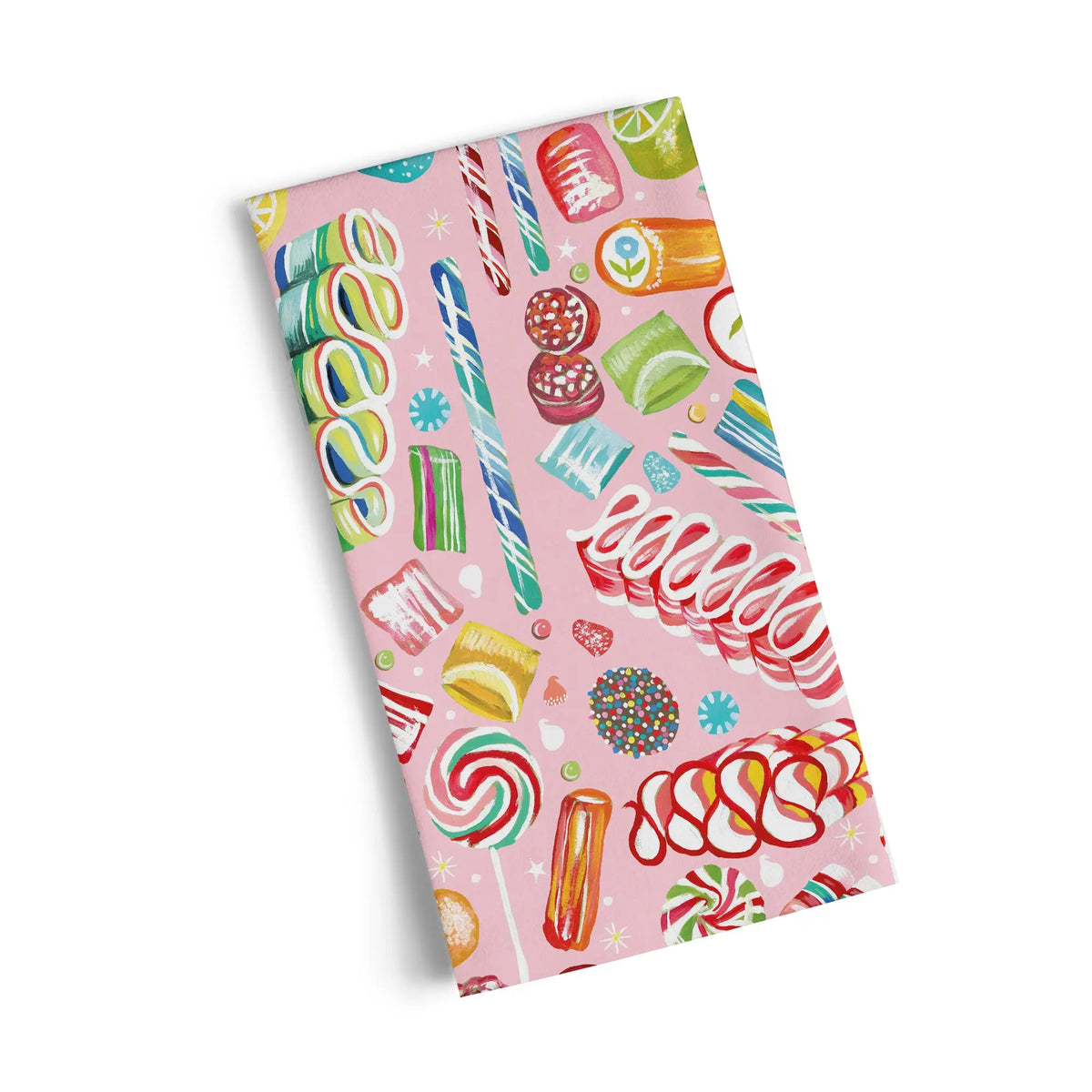 Cotton tea towel in pink featuring a playful, colorful pattern of assorted holiday candies and sweets.