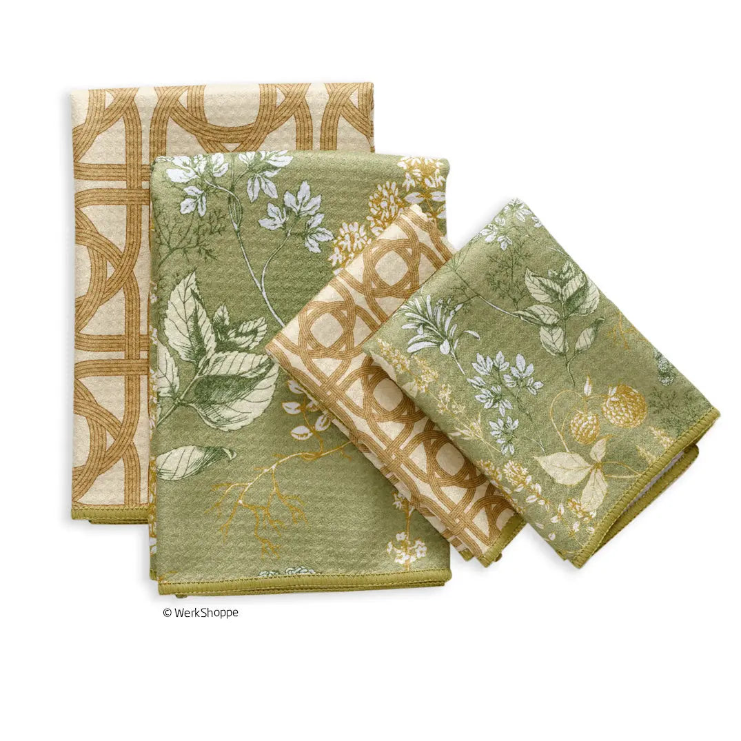 Set of all-purpose kitchen towels with sage green botanical herb prints and tan woven lattice geometric patterns.