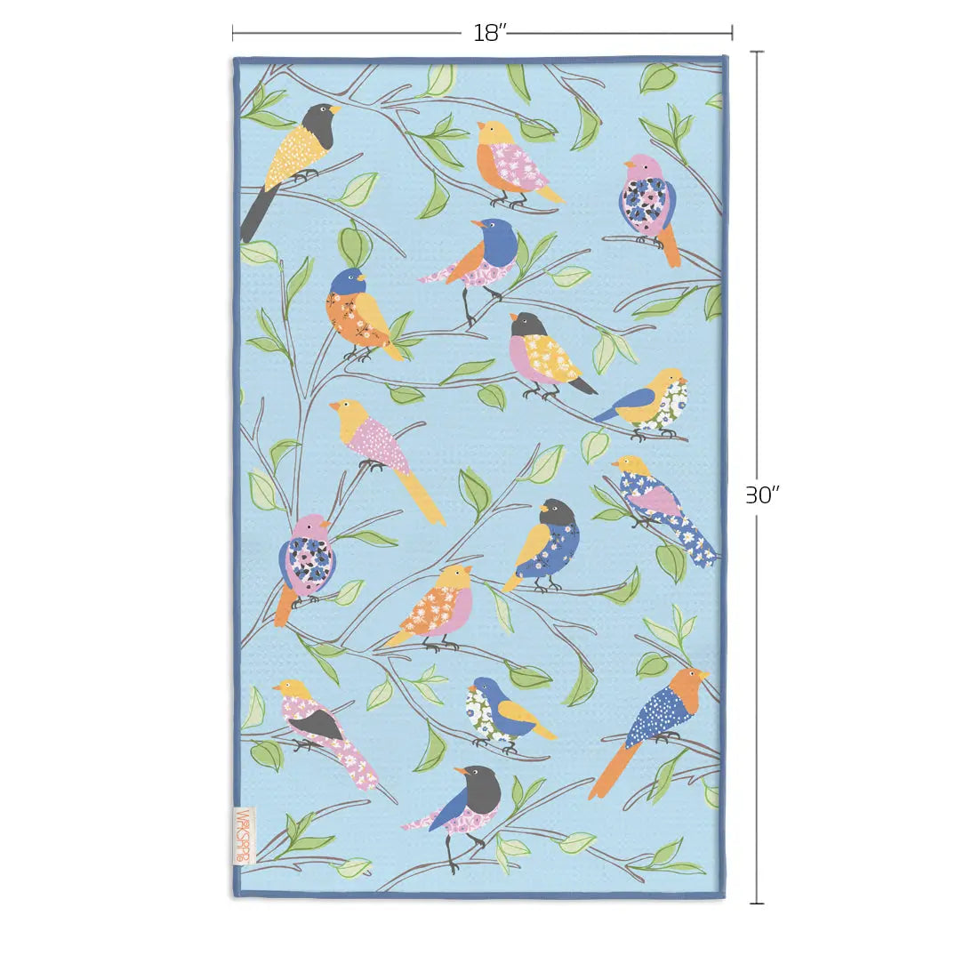 Microfiber towel with light blue background, bird-and-branch pattern, and blue edges. Dimensions labeled 18" by 30".