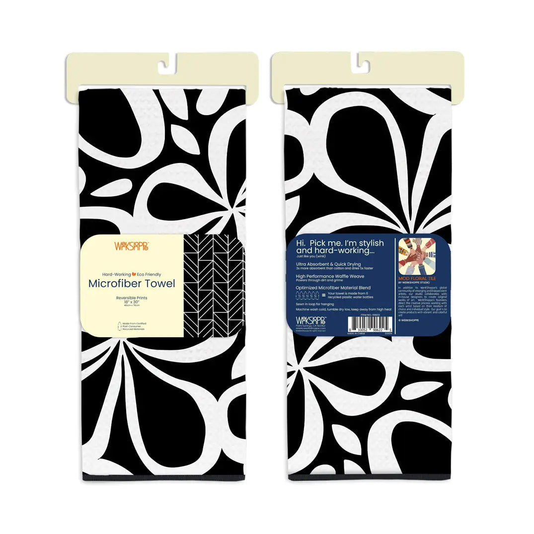 Black and white microfiber towel with a modern floral tile pattern, shown folded in packaging.