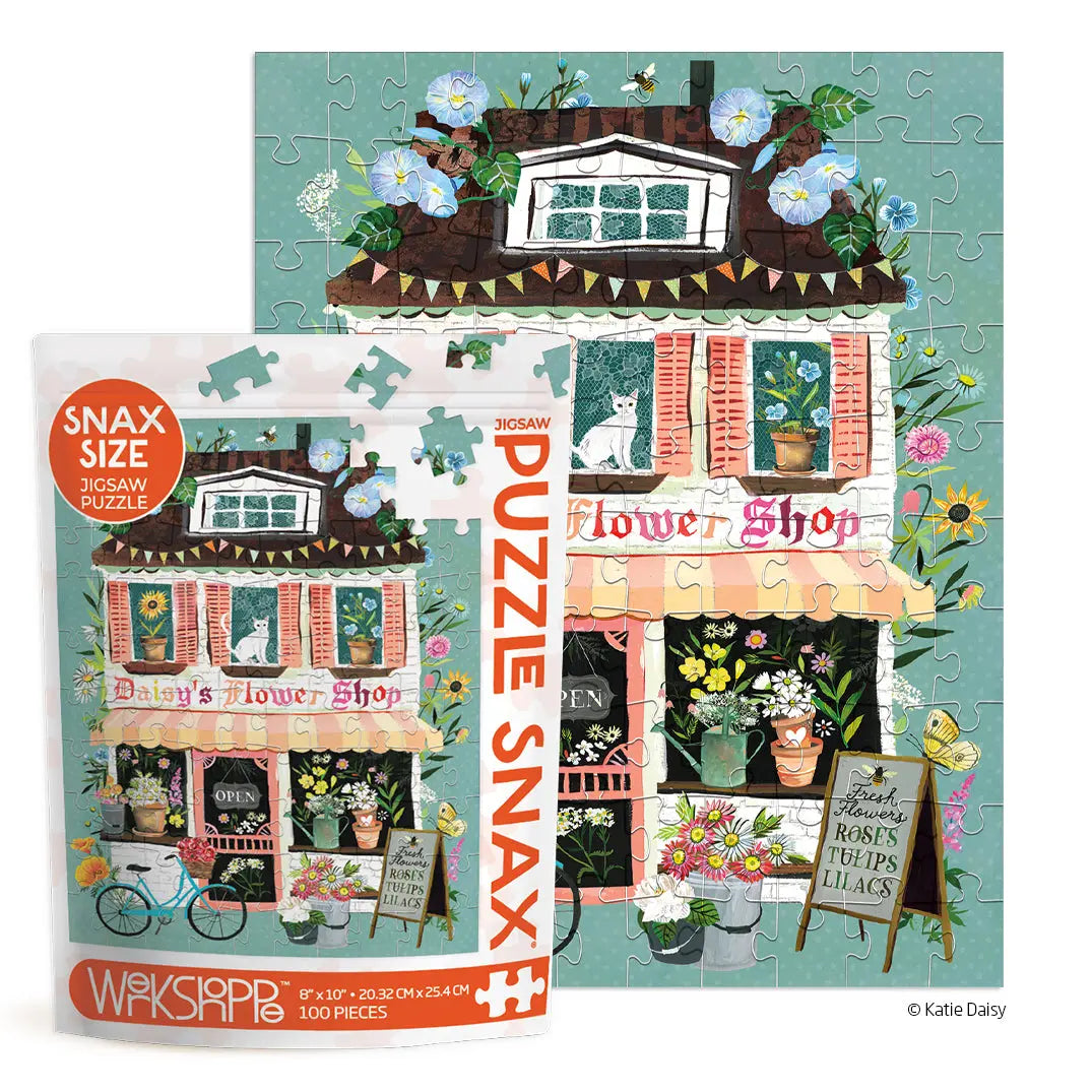 Daisy's Flower Shop 100-piece puzzle showing a whimsical illustrated shop with flowers, a white cat, and a bicycle.
