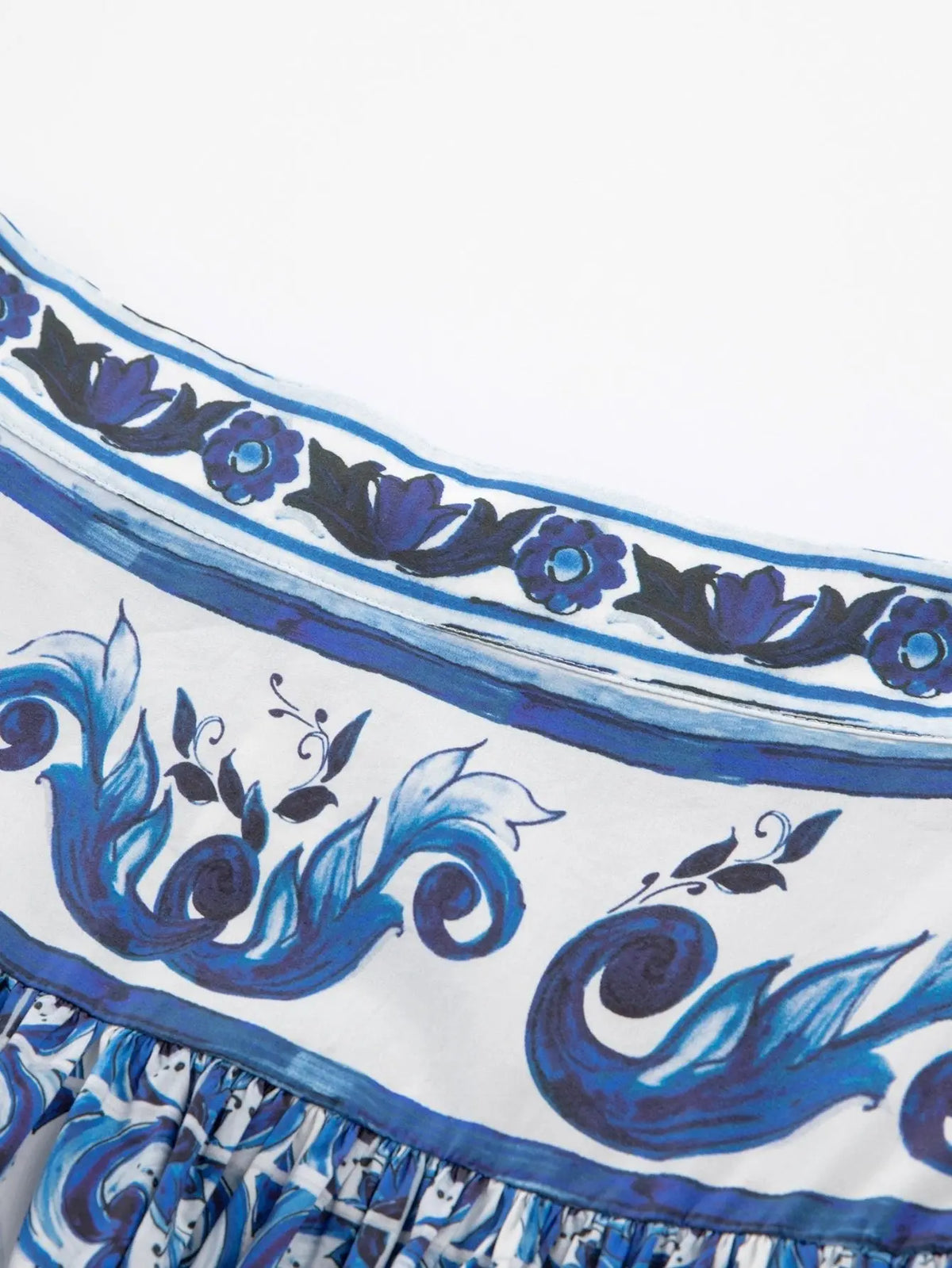 Cotton maxi skirt with blue and white Majolica porcelain-inspired floral and scroll print and gathered waistband.