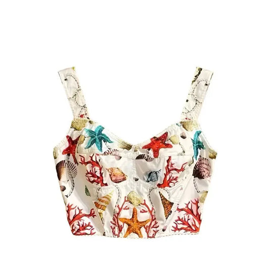 White cotton bustier top featuring a vibrant print of colorful seashells, starfish, and coral reefs.