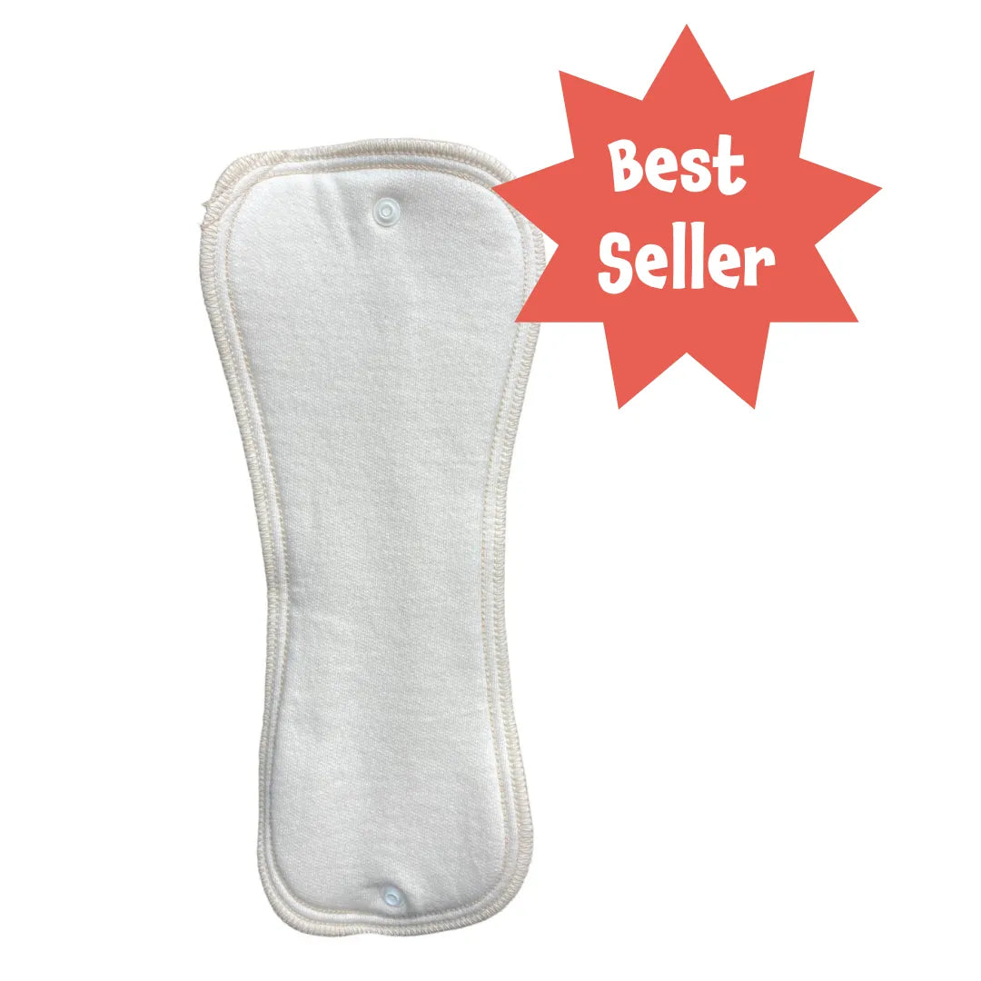 White fabric hourglass-shaped snap-in diaper pad with serged edges and snaps, featuring a red "Best Seller" star.
