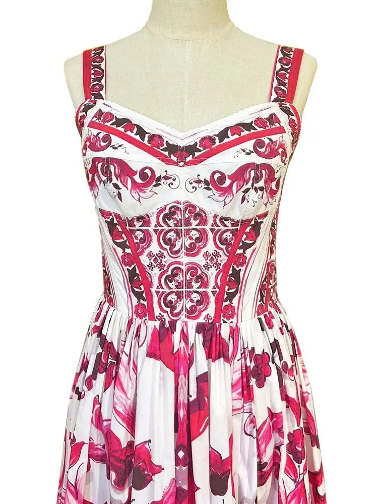 White and pink floral print dress with spaghetti straps and a fitted bodice, perfect for summer occasions.