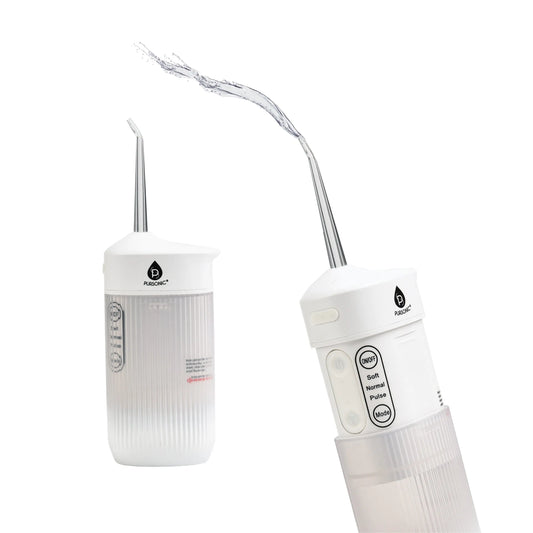 White, collapsible Pursonic water flosser with three cleaning modes and a steady stream of water spraying from nozzle.