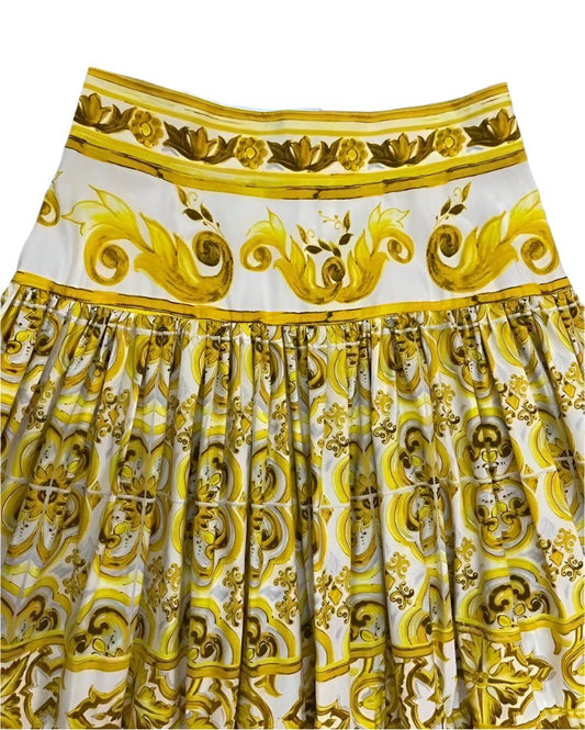Yellow and white cotton maxi skirt featuring a vibrant Majolica tile print with ornate scrolls and floral motifs.