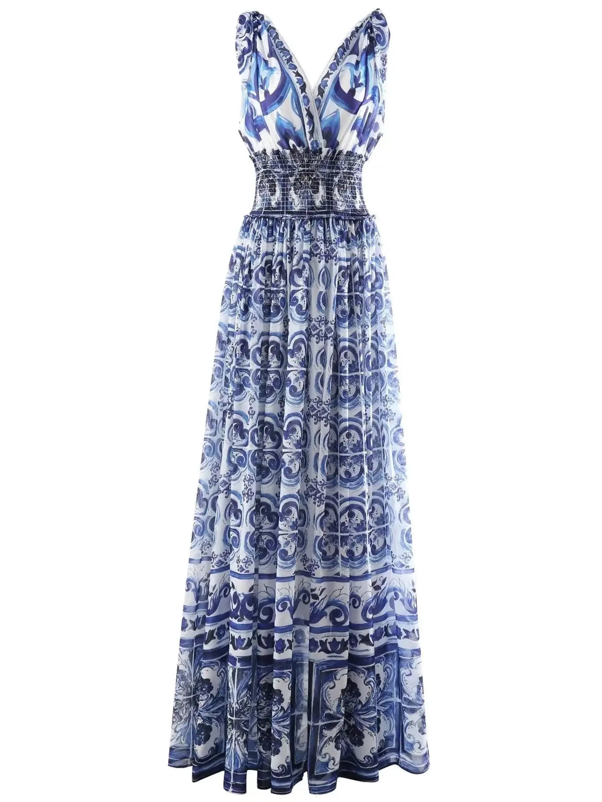 Blue and white floral maxi dress with smocked bodice, featuring a deep V-neck and elegant flowing silhouette.