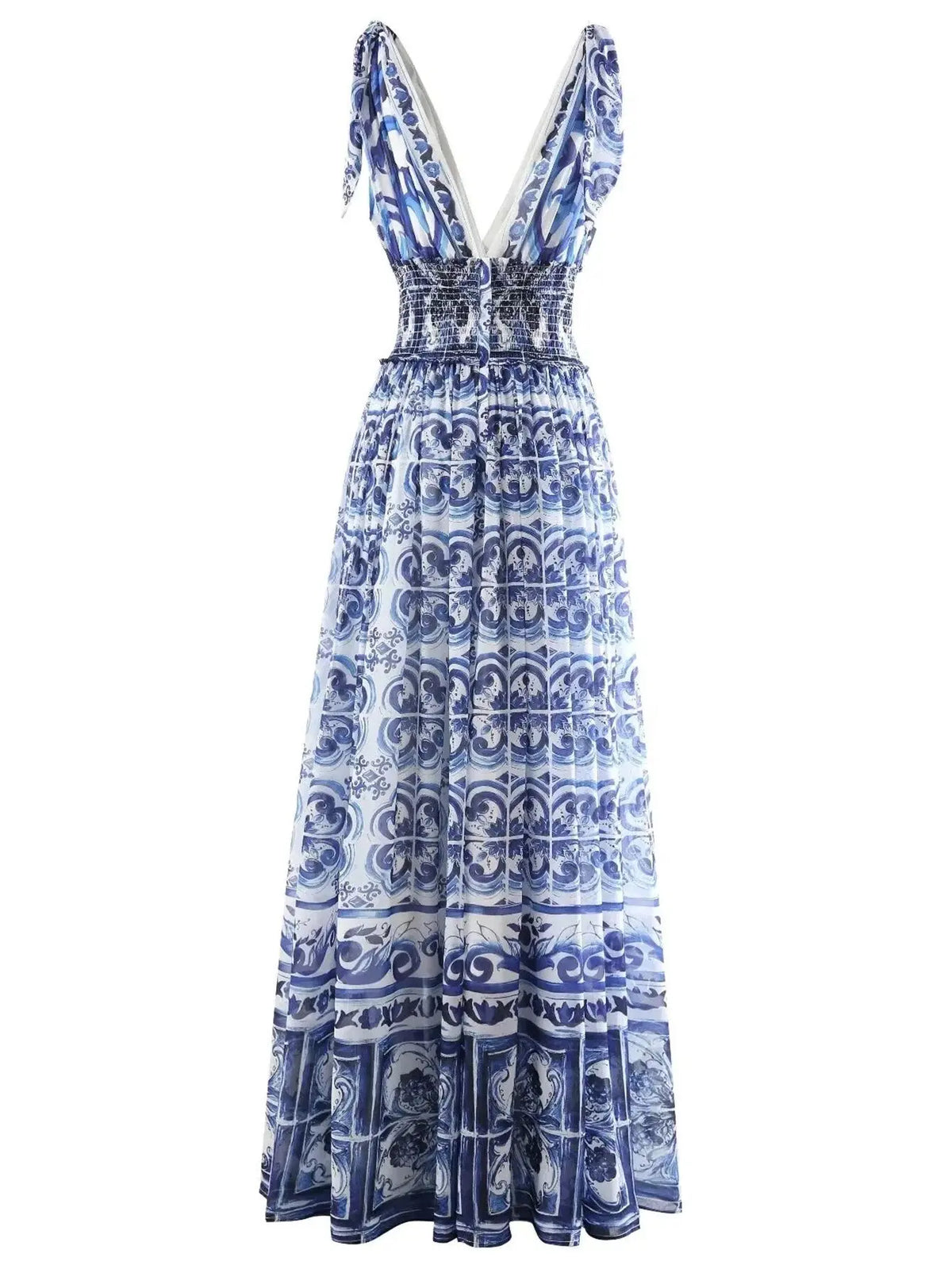 Blue and white patterned maxi dress with smocked bodice and ruffled straps, perfect for summer occasions.