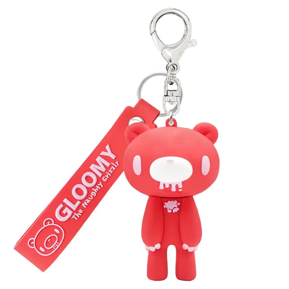 Gloomy Bear strawberry-red rubber figure keychain with a branded strap and silver metal lobster clasp.