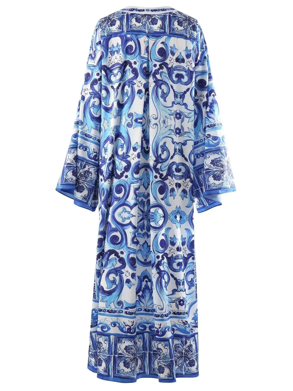 Blue patterned kaftan dress, featuring intricate designs and flowing sleeves, perfect for summer style.