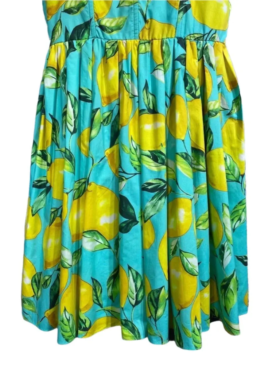 Turquoise lemon print cotton dress with vibrant yellow fruits and green leaves, perfect for summer outings.
