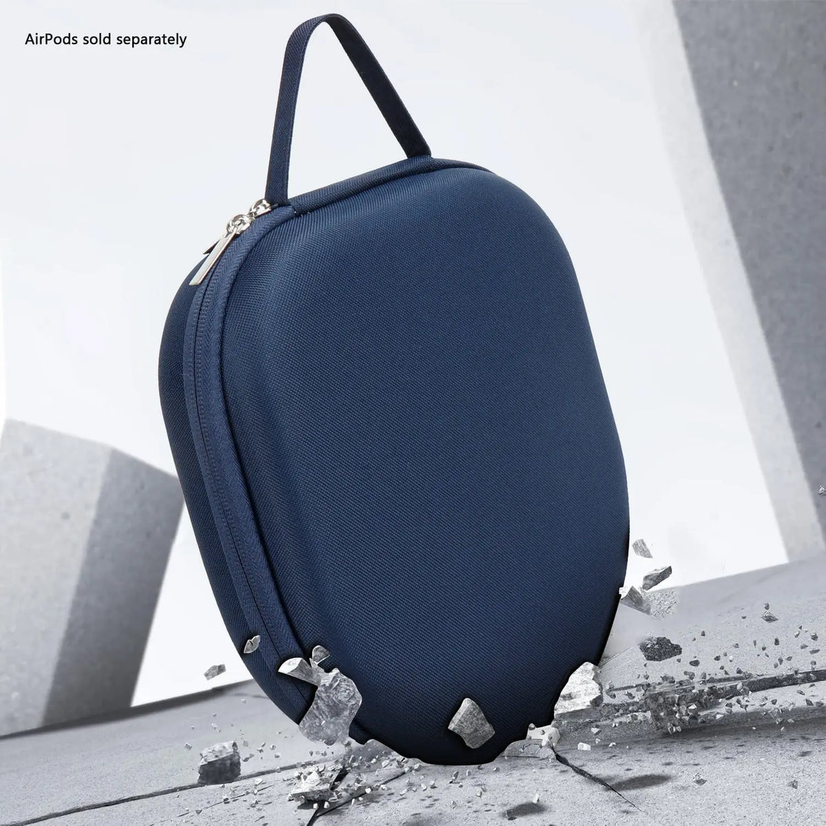 Navy blue, hard-shell, fabric-textured travel case for AirPods Max with a top carrying handle and secure zipper.