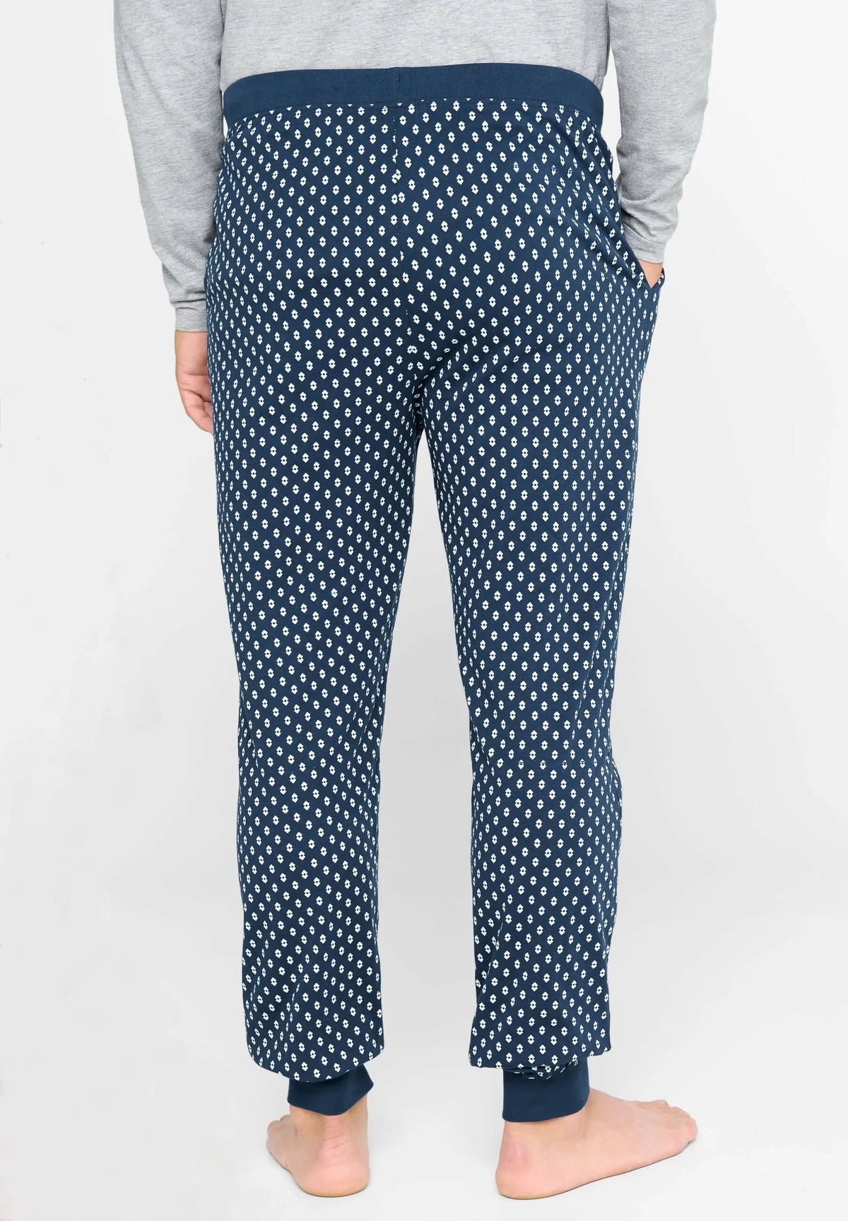 Pantalón de pijama largo para hombre en punto de algodón azul con estampado de pequeños cuadros y puños ajustados.