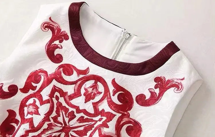 Elegant white dress with burgundy floral embroidery and a zip closure, perfect for special occasions.