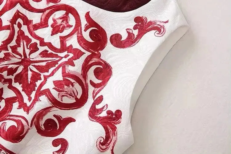 Elegant white dress with burgundy embroidered floral and paisley patterns, perfect for special occasions.