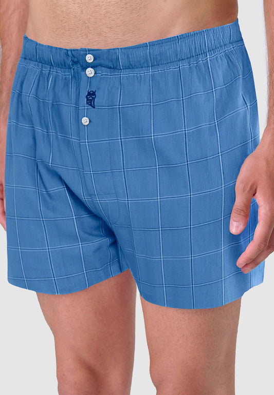 Calzoncillo bóxer para hombre de algodón azul con estampado de cuadros, estilo holgado con botones y cintura elástica.