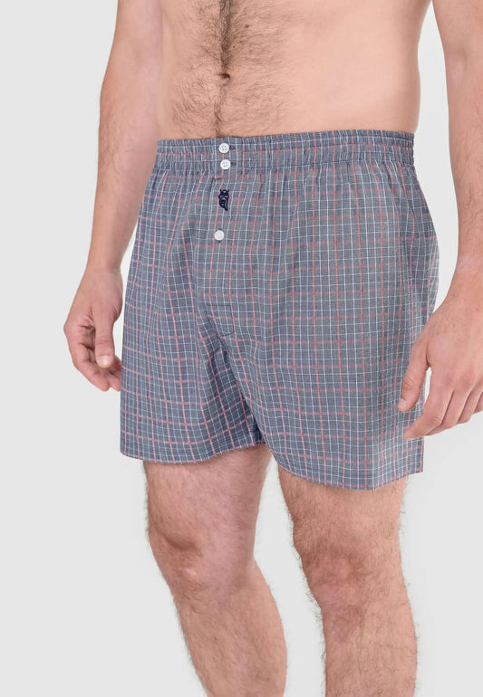 Calzoncillo bóxer para hombre de algodón, ajuste holgado, estampado a cuadros en gris con detalles en rojo.