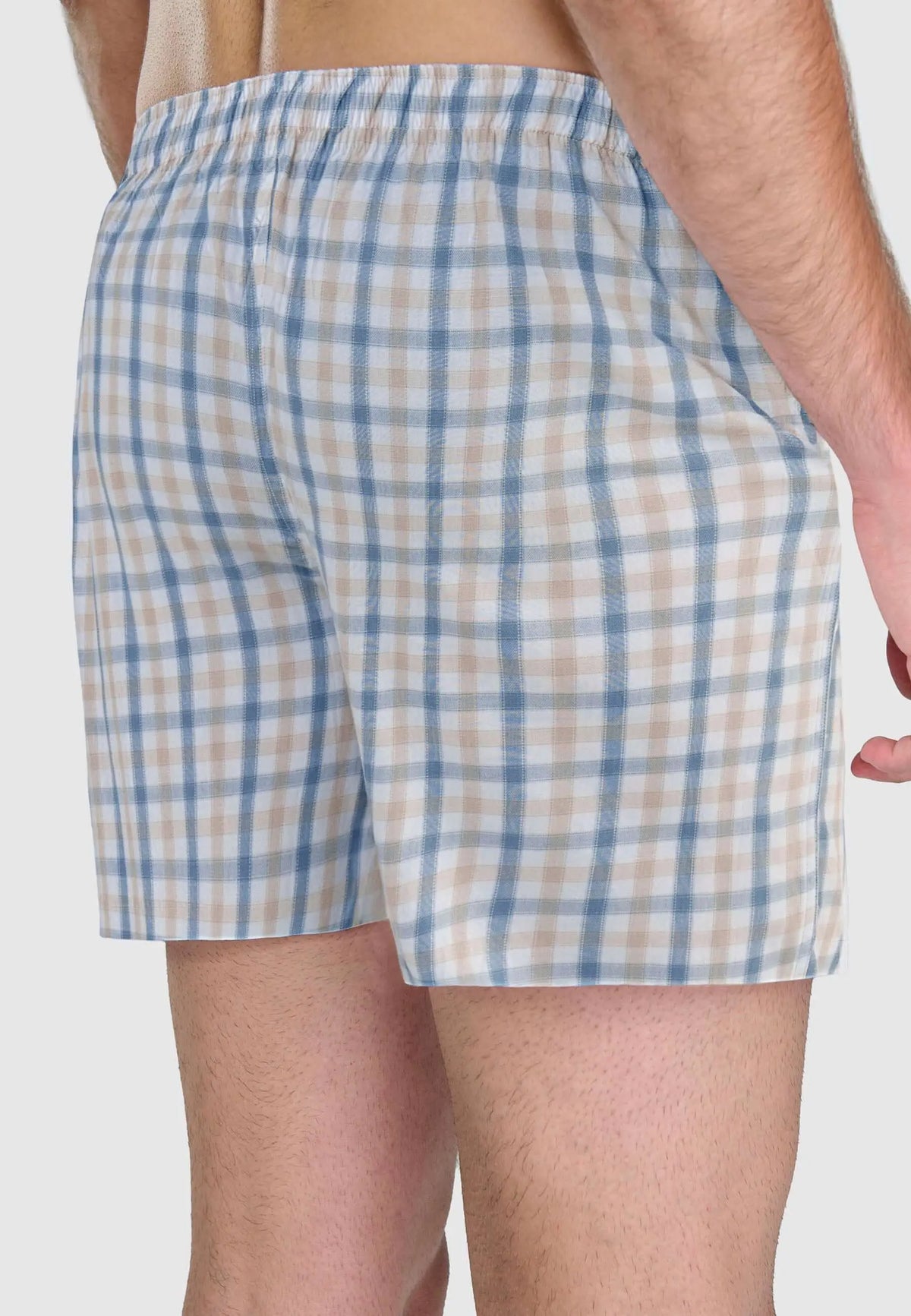 Calzoncillo bóxer de hombre en algodón, ajuste holgado con estampado de cuadros en tonos azules y beige.