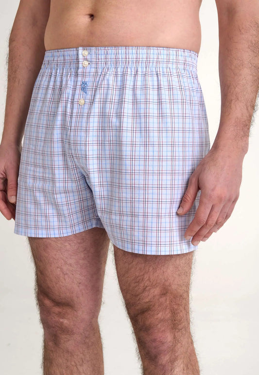 Calzoncillo bóxer para hombre de algodón popelín, diseño de cuadros azules y blancos con ajuste holgado y botones.