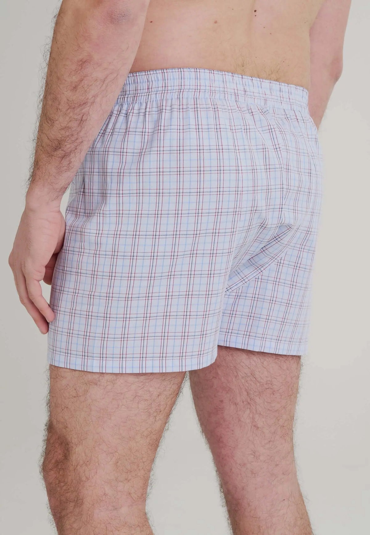 Calzoncillo bóxer de hombre en algodón popelín, diseño de cuadros azules, ajuste holgado y cómodo con cintura elástica.