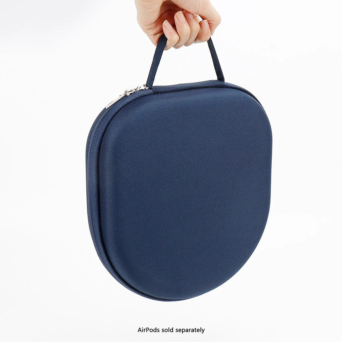 A hand holding a navy blue, oval-shaped hard shell travel case for headphones with a zip closure and carry handle.