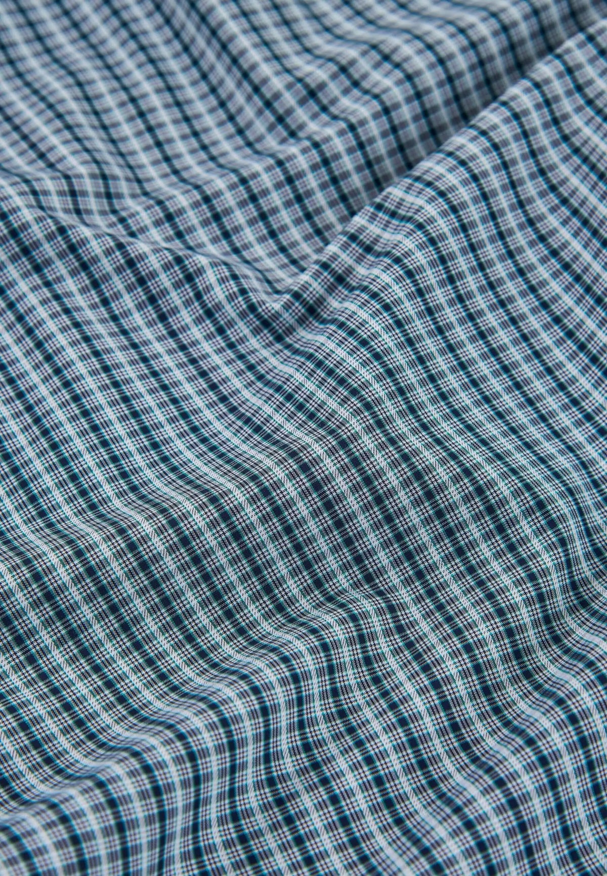Pantalón de pijama largo para hombre en algodón popelín con estampado de cuadros verdes y blancos.