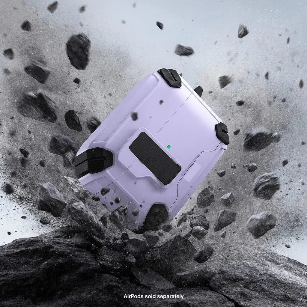 Light purple heavy-duty AirPods Pro case with black reinforced corners, secure lock, and MagSafe design amid rock debris.