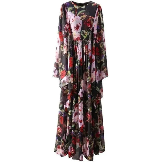 Floral maxi dress in black chiffon with long sleeves and a flowing skirt, featuring vibrant pink and red flowers.