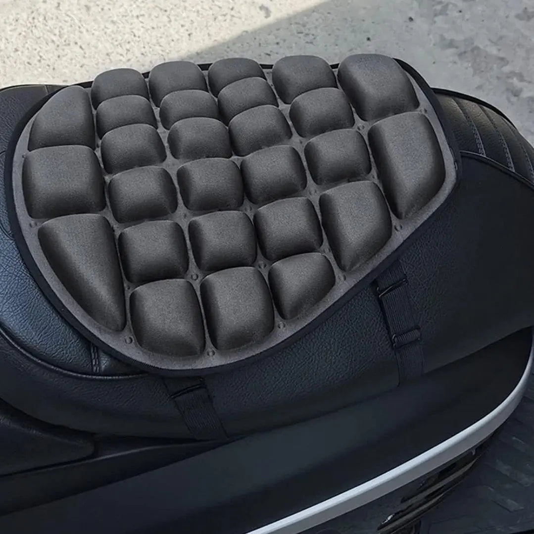 Black gel seat cushion with bubble design for motorcycle comfort, suitable for long rides.
