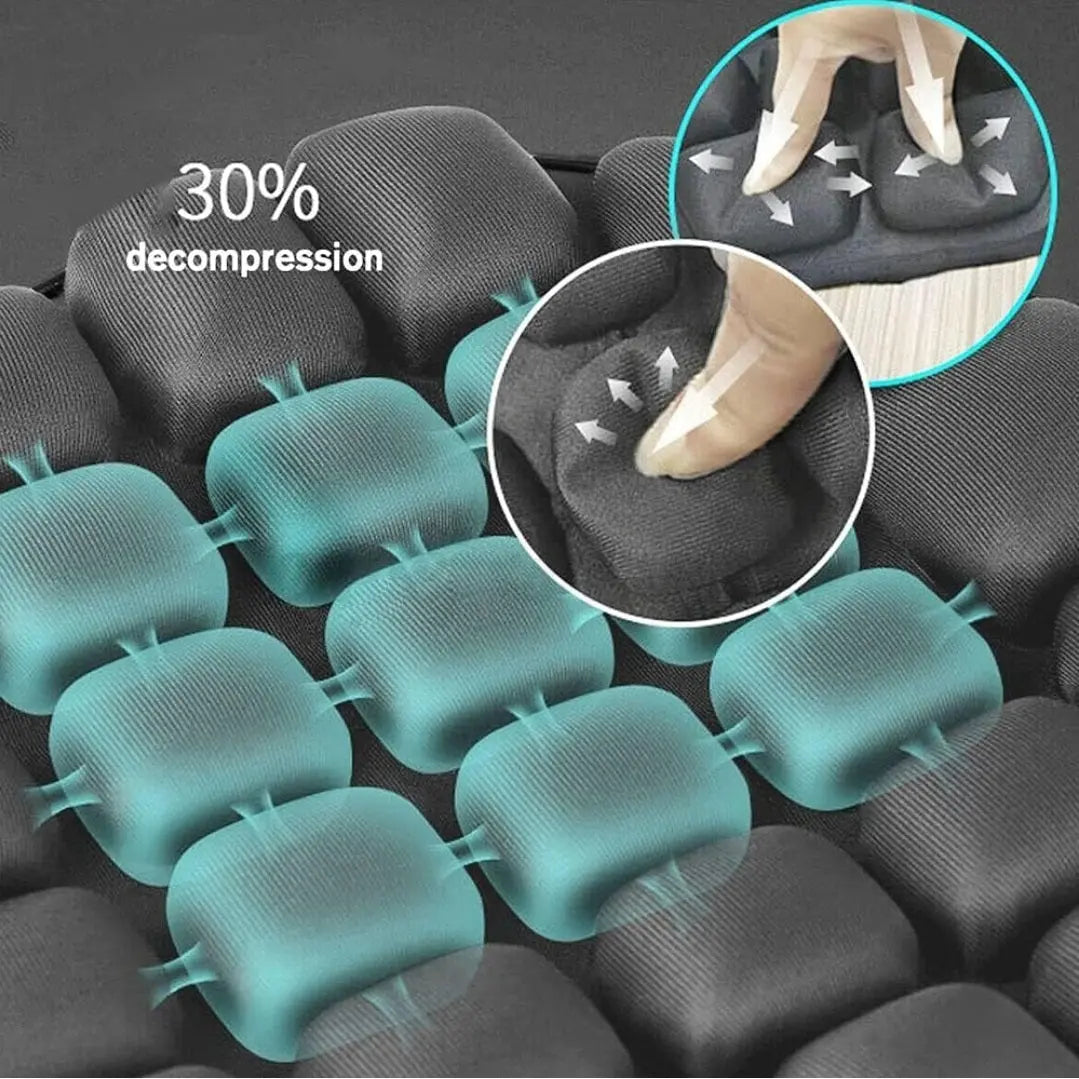 Black ergonomic seat cushion with gel padding showing 30% decompression and pressure relief points.