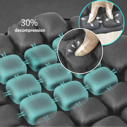 Black ergonomic seat cushion with gel padding showing 30% decompression and pressure relief points.