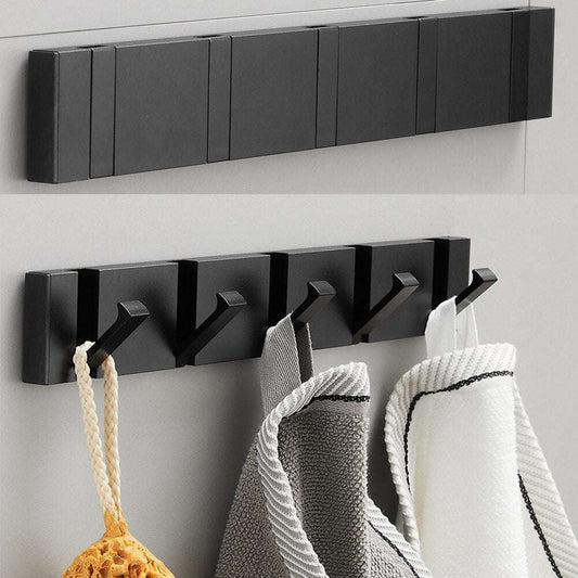 Perchero de pared moderno en metal negro mate con ganchos plegables, ideal para colgar accesorios con estilo minimalista.