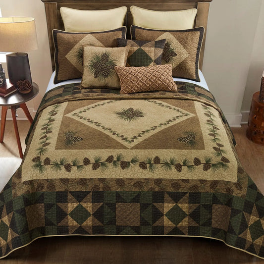 Rustic quilt set in brown and green tones featuring pine cone patterns, plaid geometric borders, and matching shams.