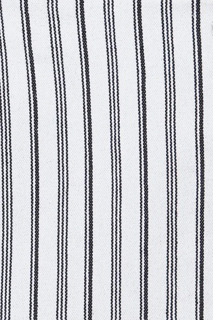 Close-up of white canvas fabric featuring a repeating pattern of thin, vertical black woven stripes.