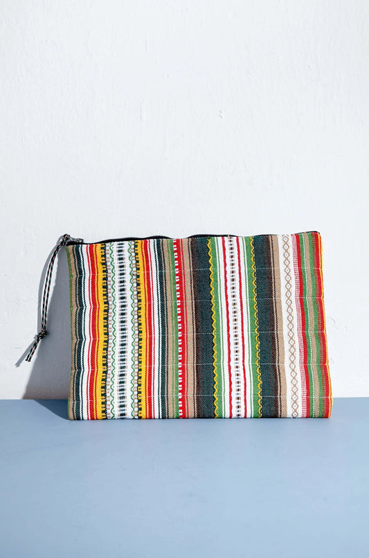 Padded laptop or tablet sleeve featuring a vibrant, multi-colored vertical stripe pattern with a black zipper closure.