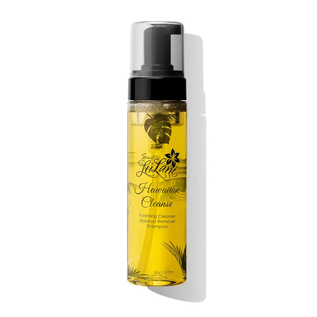 Clear pump bottle of golden liquid facial cleanser with Sweet LeiLani branding and tropical leaf illustrations.