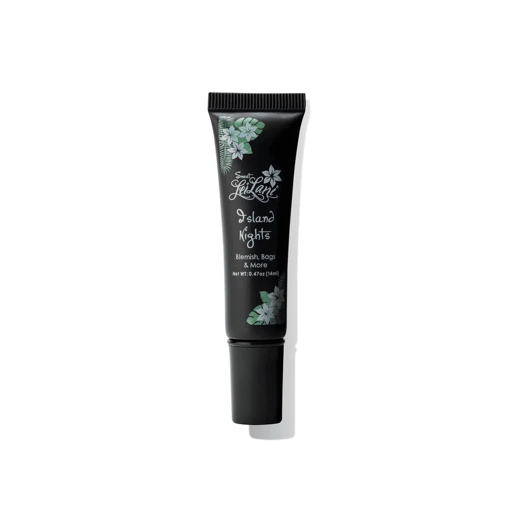 Black squeeze tube of Island Nights under-eye cream, featuring tropical floral accents and white text.
