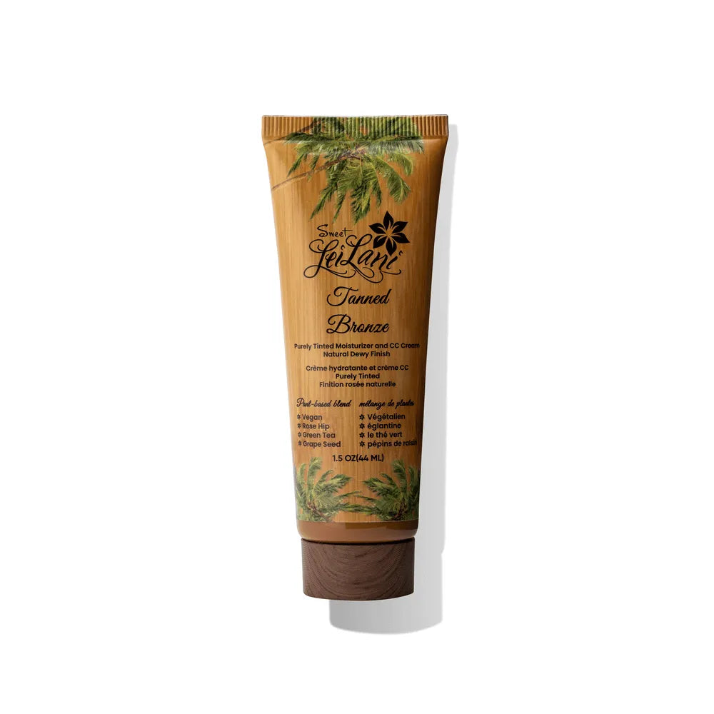 Tanned Bronze CC cream tube with bamboo texture, palm tree graphics, and dark brown cap. 1.5 oz, vegan formula.