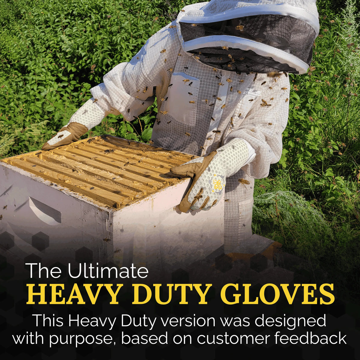 Beekeeper wearing protective gear and tan leather gloves with white ventilated cuffs while working on a wooden hive.