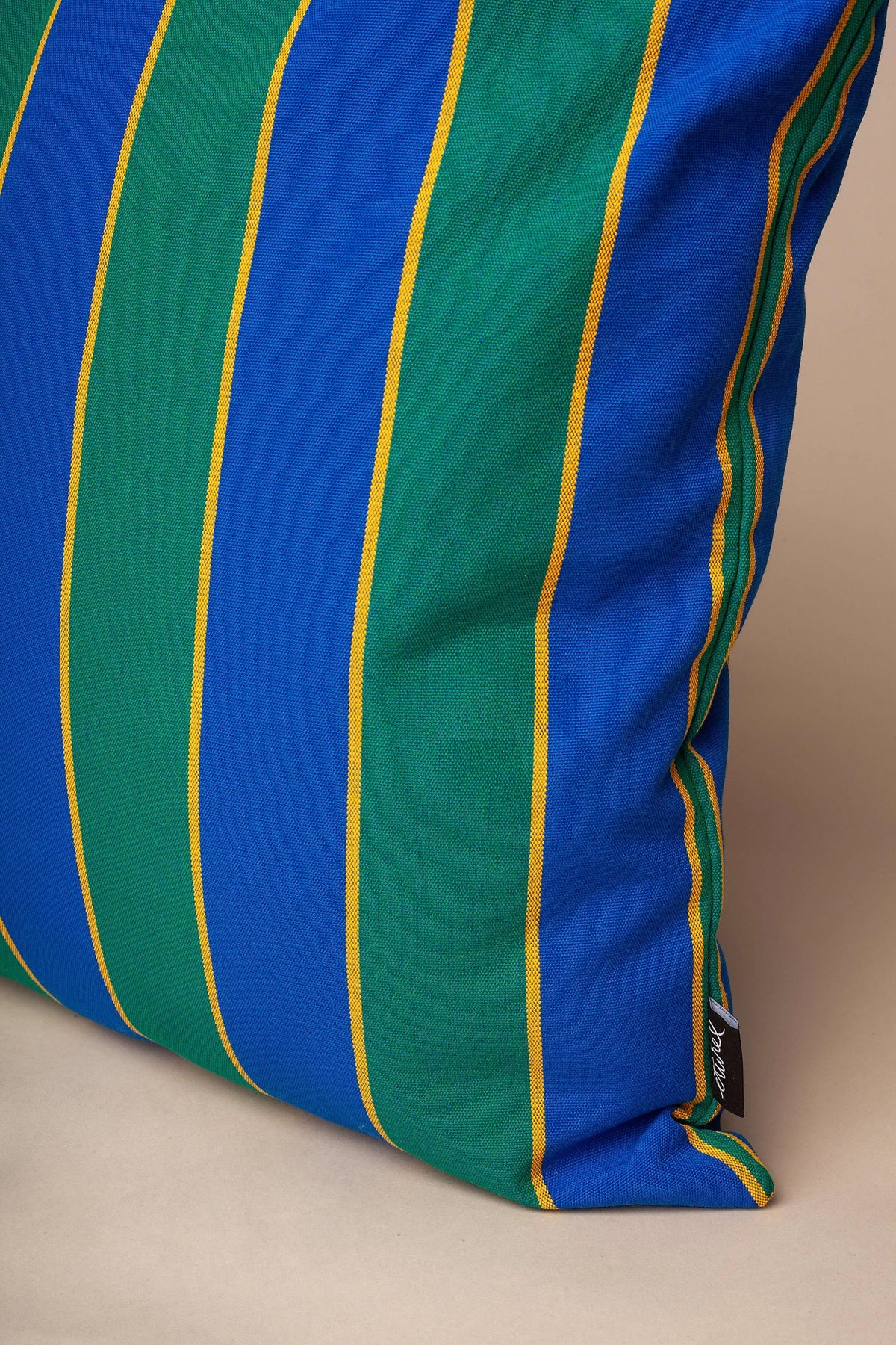 Square cushion cover in heavy canvas with vertical blue, green, and thin yellow stripes.