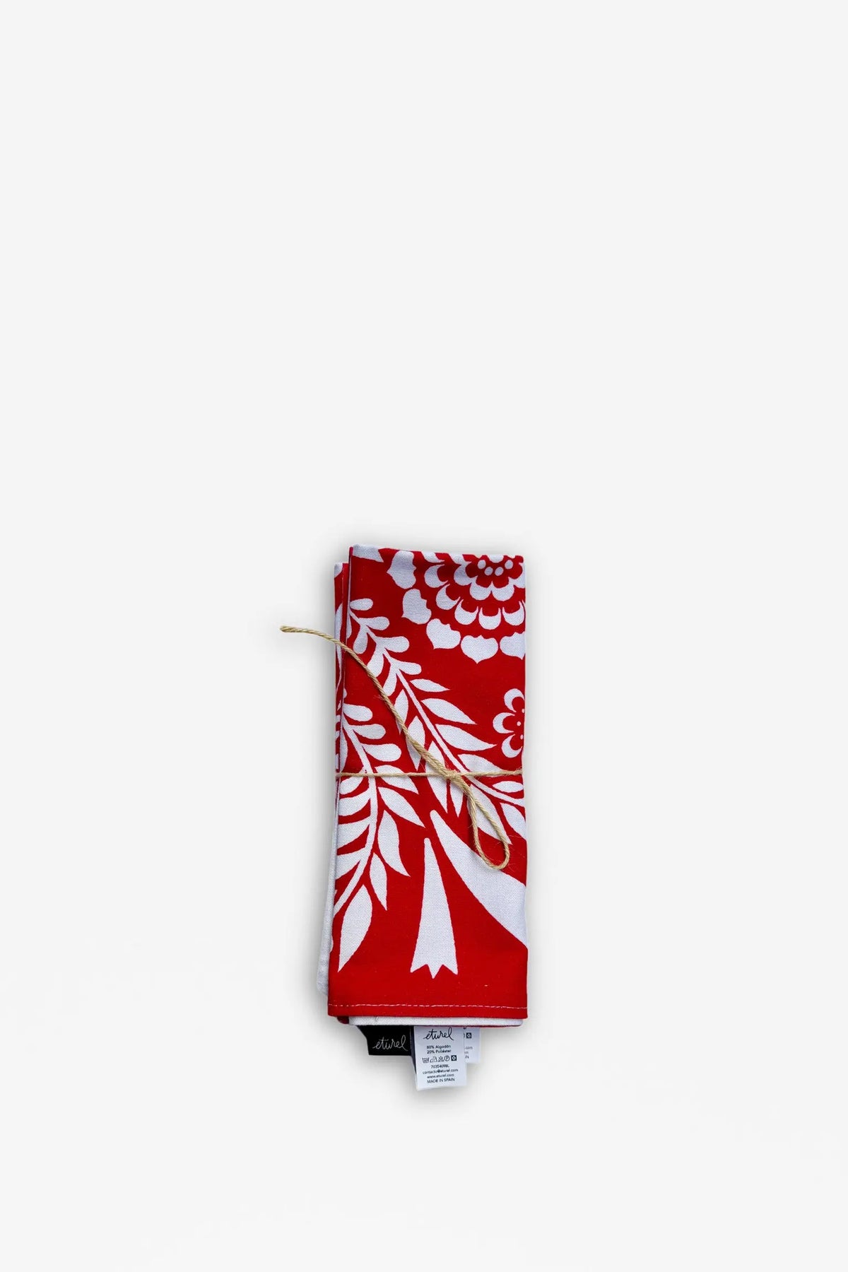 Pack de 2 manteles individuales reversibles de tela con estampado floral blanco sobre fondo rojo, atados con cuerda.