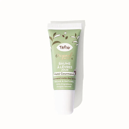 Sage green squeeze tube of lip balm with white cap, featuring brown text and leaf illustrations on a white background.