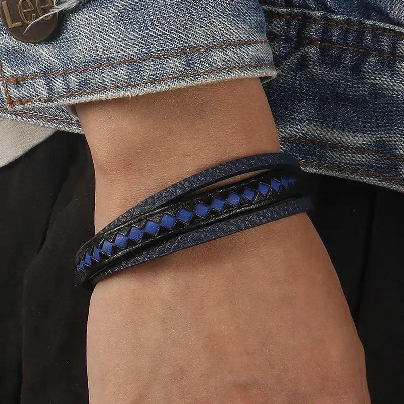 Pulsera Taurus · Pulsera de cuero auténtico trenzado con detalles azules y cierre de aluminio