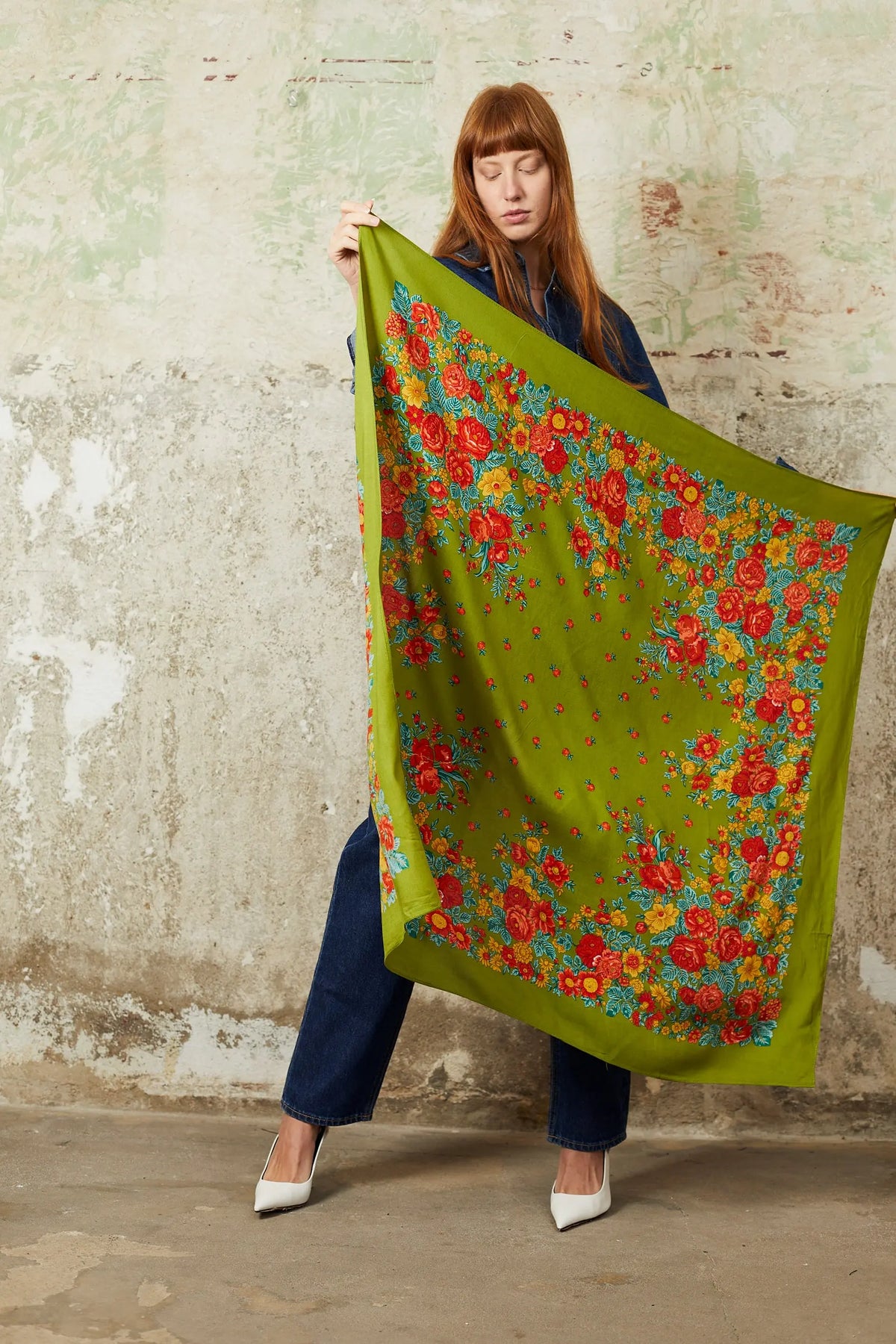 Olive green square scarf featuring vibrant red and yellow floral patterns with delicate foliage borders.