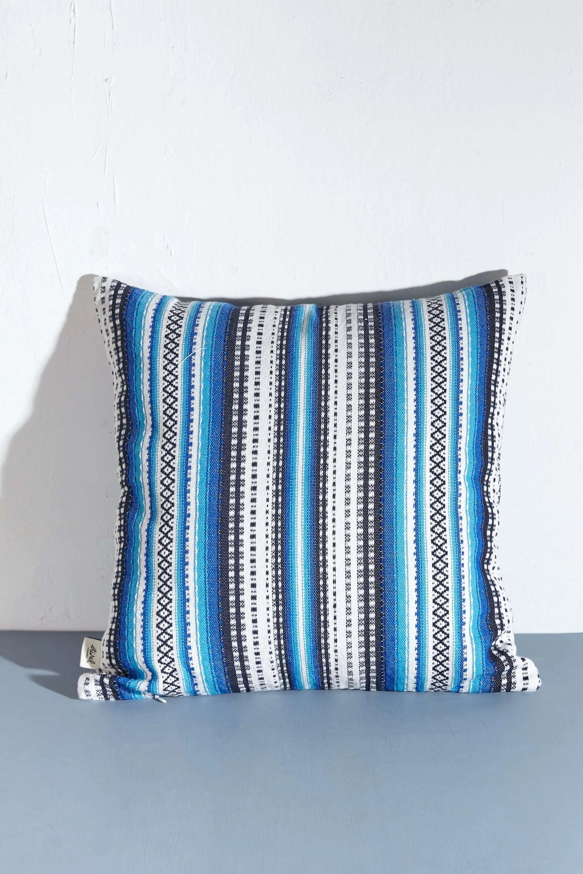 50x50cm square cushion cover featuring a blue, white, and black striped Alpujarra design with intricate woven detail.